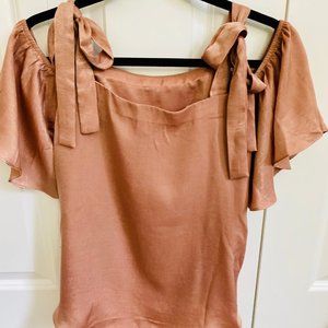 Cold shoulder top with bow tie straps.